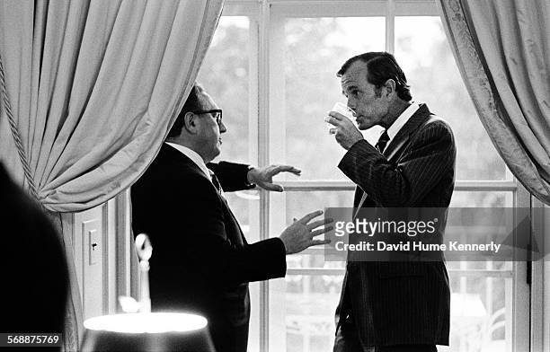 August 28: Secretary of State Henry Kissinger talks with George Bush, then Chief of the U.S. Liaison Office to the People's Republic of China, at the...