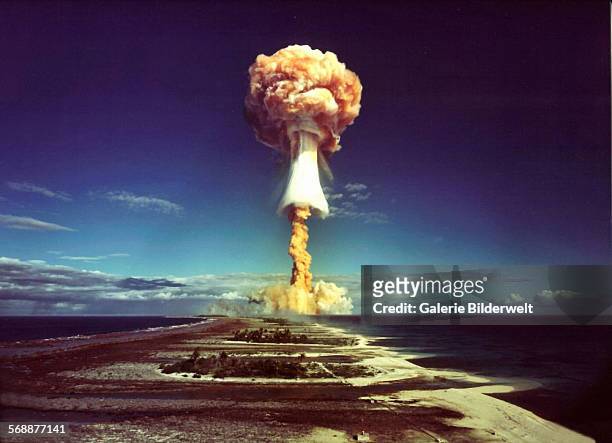 Mushroom cloud after the explosion of a French atomic bomb above the atoll of Mururoa, also known as Aopuni. 1971. From 1966until 1996 this was the...