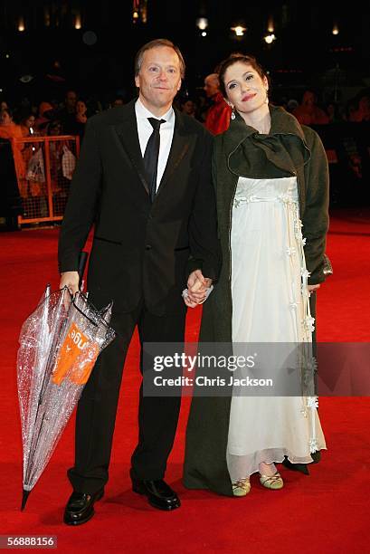 Director Fernando Meirelles and guest arrive at The Orange British Academy Film Awards at the Odeon Leicester Square on February 19, 2006 in London,...