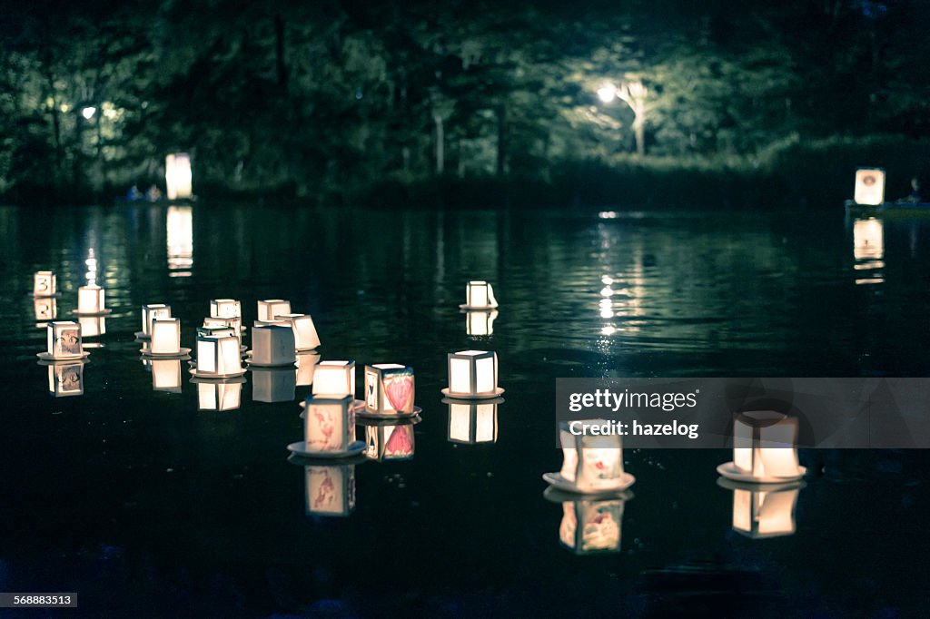 Lantern floating on the night lake