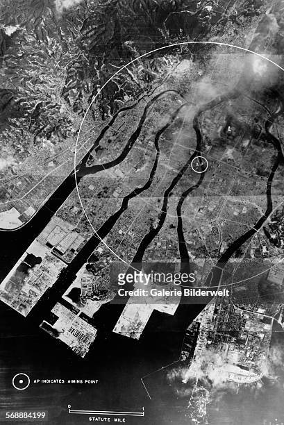 Direct vertical aerial view from a US Army Air Forces reconnaissance aircraft of the Japanese city of Hiroshima, Japan, prior to the 'Little Boy'...