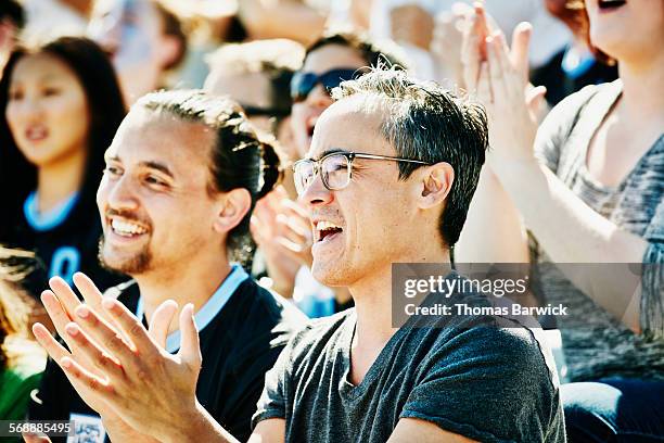 Man Clapping During Soccer Match In Stadium High-Res Stock Photo ...