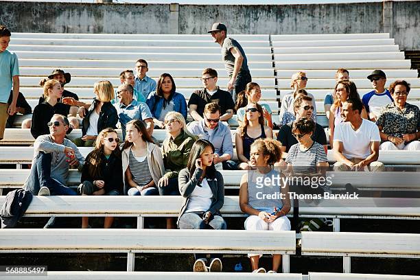 crowd of sports fans gathering in stadium - avvenimento sportivo foto e immagini stock