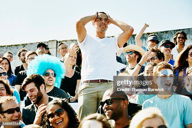 disappointed soccer fan with hands over head - missing emotion stock pictures, royalty-free photos & images