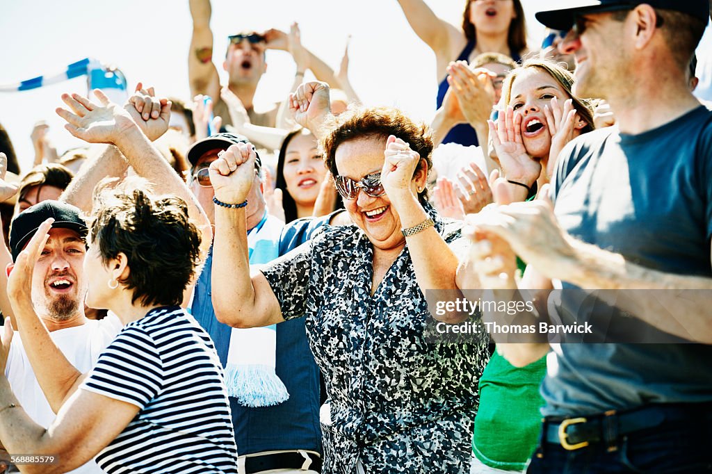 Senior woman celebrating during soccer match