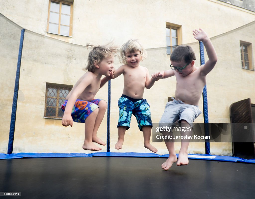 Three boys on trampoline