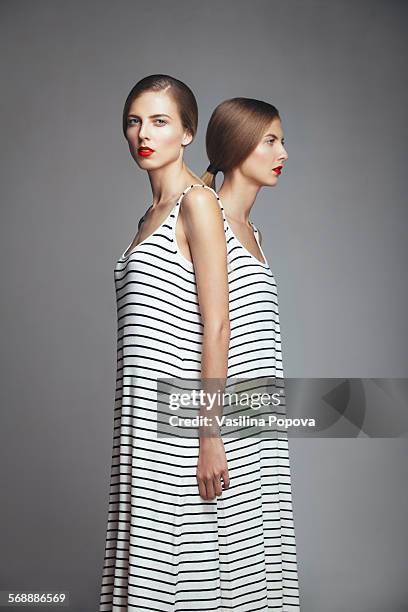 beautiful twins - symmetry people stock pictures, royalty-free photos & images