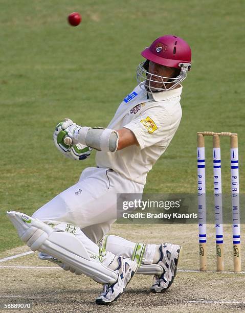 Martin Love of the Bulls avoids being hit by the ball during day two of the Pura Cup match between the Queensland Bulls and the South Australian...