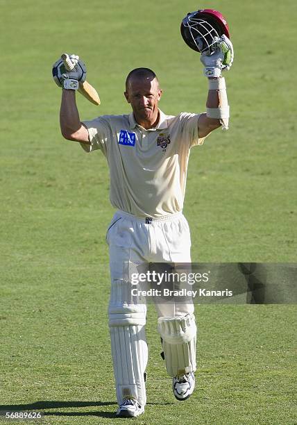 Clinton Perren of the Bulls celebrates scoring his century during day two of the Pura Cup match between the Queensland Bulls and the South Australian...
