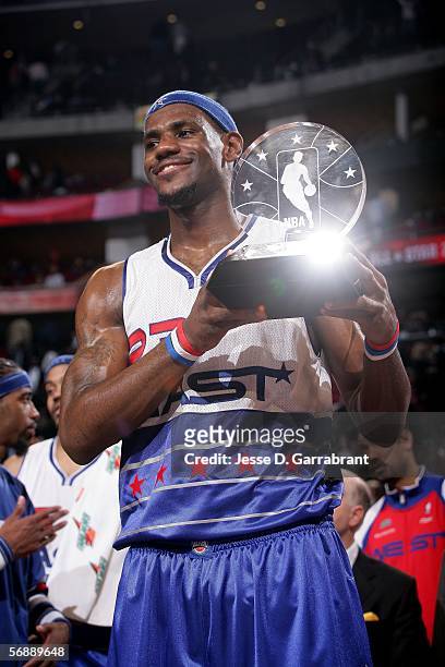 All-Star Game Most Valuable Player LeBron James#23 of the Eastern Conference celebrates with the trophy following the East's 122-120 win over the...