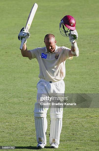 Clinton Perren of the Bulls celebrates scoring his century during day two of the Pura Cup match between the Queensland Bulls and the South Australian...