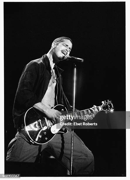 Singer Chris Cornell performing on stage with his band 'Soundgarden', 1993.