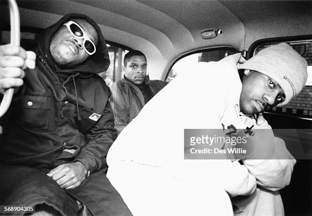 Portrait of the band 'Naughty by Nature' in the back of a taxi, circa 1992.