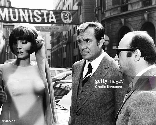 Italian actors Ugo Tognazzi and Maria Grazia Buccella filming a scene for the film 'Sissignore', Milan, April 1968.