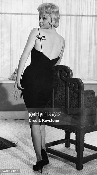 Portrait of actress Nadja Tiller wearing a revealing dress, promoting the film 'The Rough and the Smooth', London, March 20th 1959.