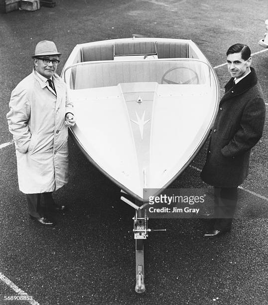 Campbell's chief mechanic Leo Villa and Ken Norris, director of the boat makers firm, pictured with a modified version of the water propelled...