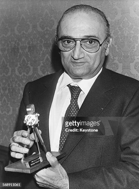 Playwright Henri Verneuil with his Camera d'Or award at the Cannes Film Festival, 1964.