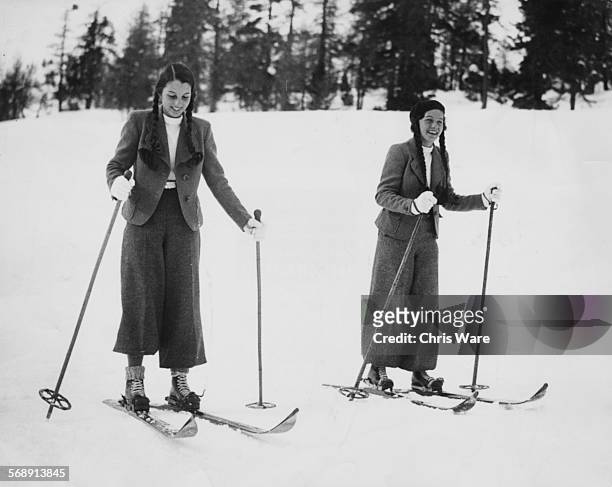 Portrait of Princesses Fawzia and Faeza, singers of King Farouk of Egypt, skiing during their first trip to Europe, St Moritz, circa 1935.