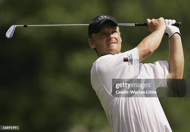 Soren Kjeldsen of Denmark plays his second shot into the the 13th green during the final round of the Maybank Malaysian Open 2006 at the Kuala Lumpur...