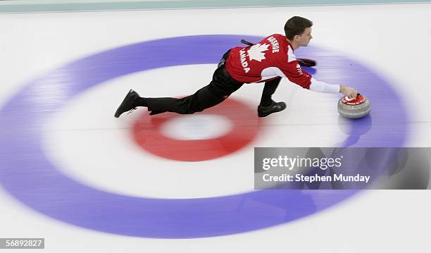 Brad Gushue of Canada throws the stone during the preliminary round of the men's curling between Canada v USA during Day 10 of the Turin 2006 Winter...