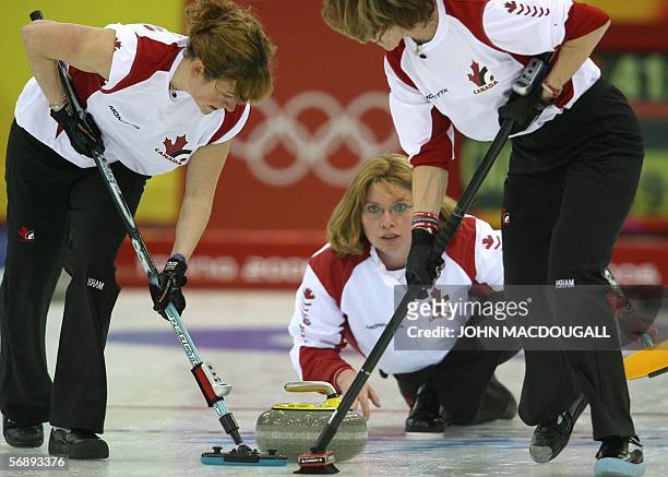 Canada's skip Shannon Kleibrink releases the stone during the Denmark vs Canada match in the women's round robin curling event at the 2006 Turin...