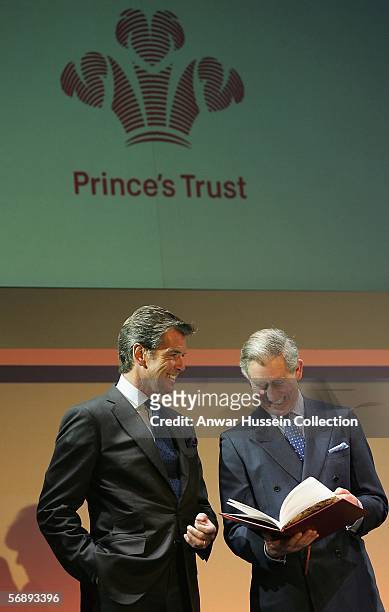 Prince Charles, the Prince of Wales looks at a book of letters from thirty young people helped by Prince's Trust in the last thirty years of Prince's...