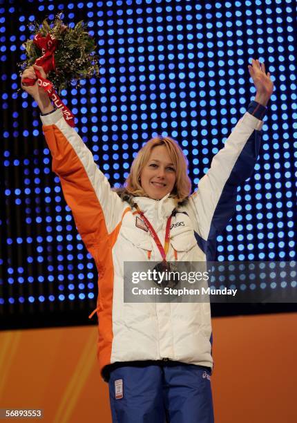 Marianne Timmer of Holand celebrates receiving the Gold Medal in the women's 1000m speed skating during the Medal Ceremony on Day 10 of the Turin...