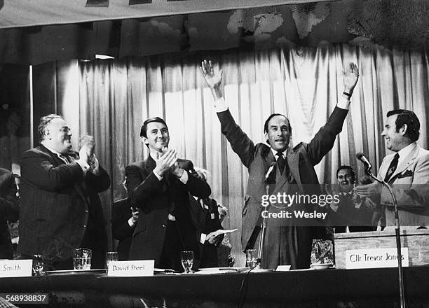 Liberal Party leader Jeremy Thorpe raising his arms as he is applauded by the crowd, with fellow MP's Cyril Smith, David Steel and Trevor Jones, at...