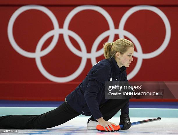 The US' skip Cassie Johnson follows her throw during the USA vs Great Britain match in the women's round robin curling event at the 2006 Turin Winter...