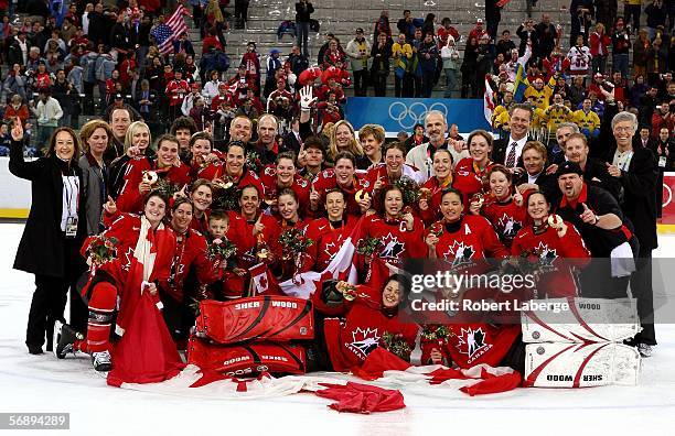 Team Canada pose for a picture after they won the gold medal in women's ice hockey match against Sweden during Day 10 of the Turin 2006 Winter...