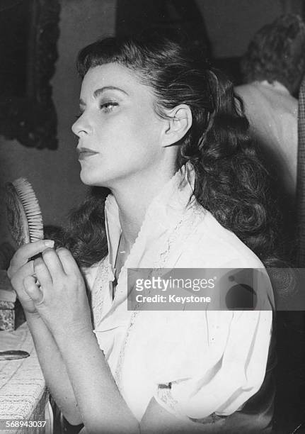Actress Alida Valli pictured in her dressing room during the filming of 'Le Reve Coffre et Le Revenant' at the Billancourt Studio, July 31st 1952.