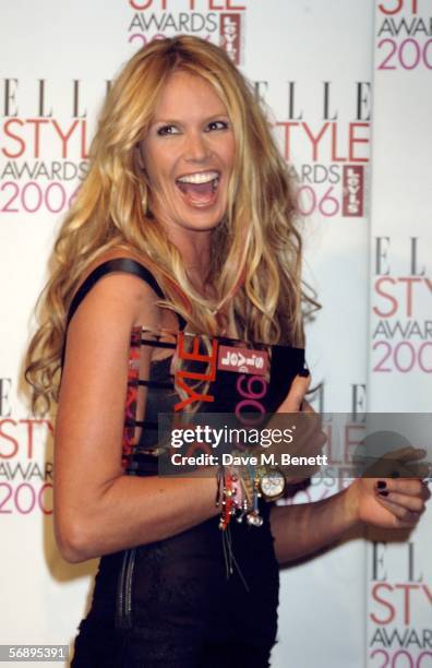 Model Elle Macpherson poses backstage in the Awards Room with the award for Style Icon at the ELLE Style Awards 2006, the fashion magazine's annual...