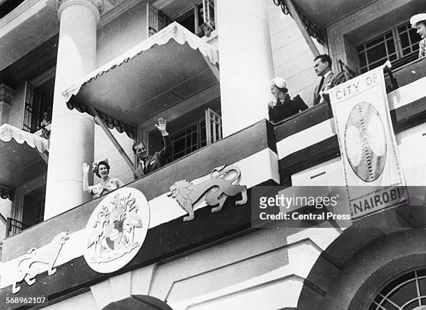 Princess Elizabeth and Prince Philip, the Duke of Edinburgh, waving from the balcony of City Hall to the crowds below, during their Commonwealth...