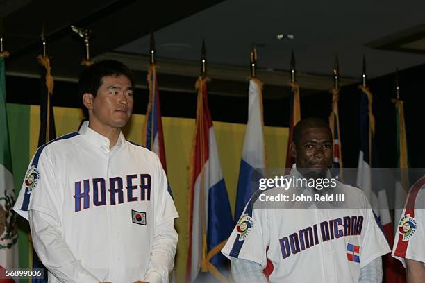 World Baseball Classic participants Hee-Seop Choi and Miguel Tejada are pictured at the WBC press conference during All-Star Week in Detroit, MI.