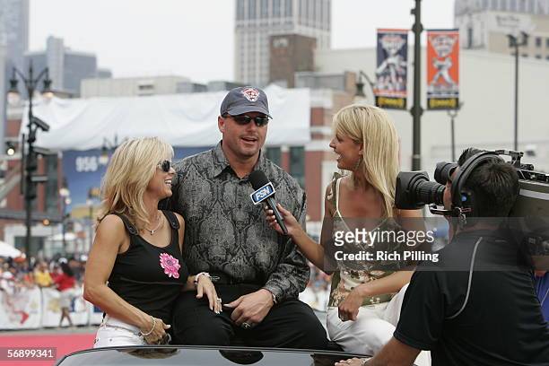 Roger Clemens of the Houston Astros and his wife Debbie are interviewed by Fox Sports reporter Carolyn Hughes on the All-Star Game Red Carpet during...