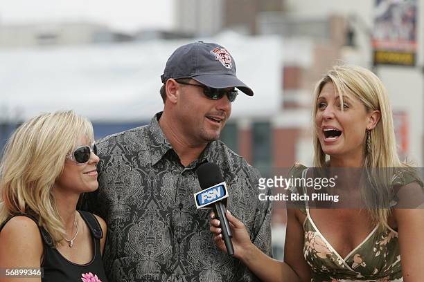 Roger Clemens of the Houston Astros and his wife Debbie are interviewed by Fox Sports reporter Carolyn Hughes on the All-Star Game Red Carpet during...