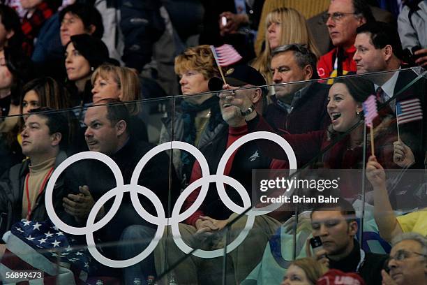 Olympic gold medalist Sarah Hughes sits in the stands moments before her sister Emily Hughes of the United States performs during the women's Short...