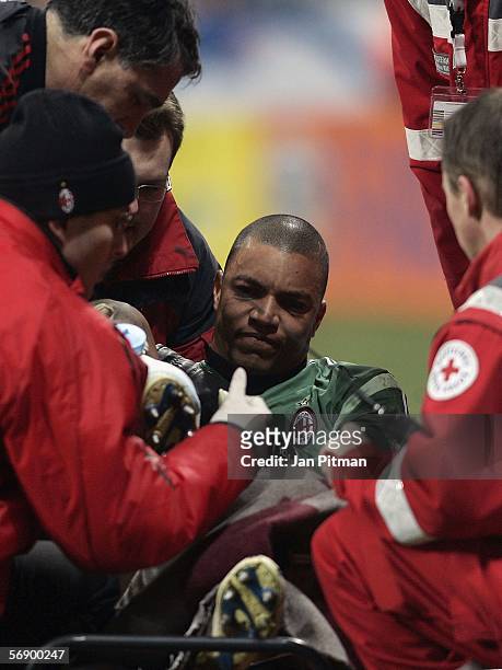 Dida, the goalkeeper of AC Milan, gets medical treatment after he was injured during the UEFA Champions League round of 16, first leg match between...
