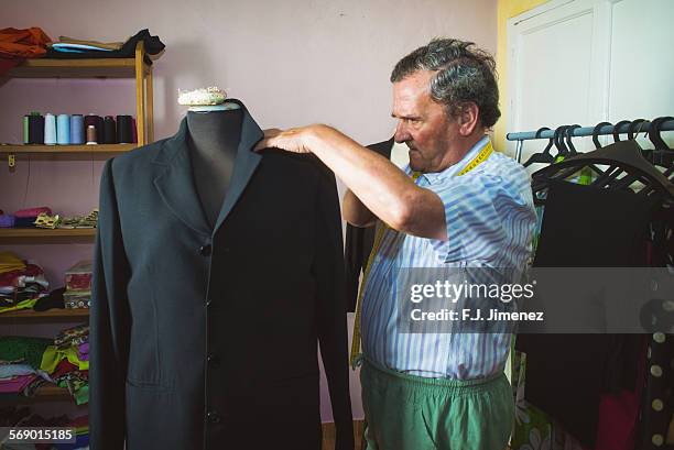 elderly man while sewing in a tailoring - sewing basket stock pictures, royalty-free photos & images