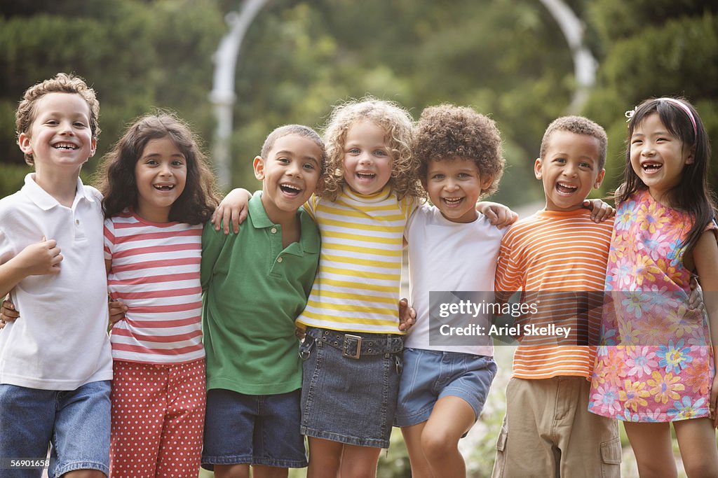 Portrait of children arm in arm