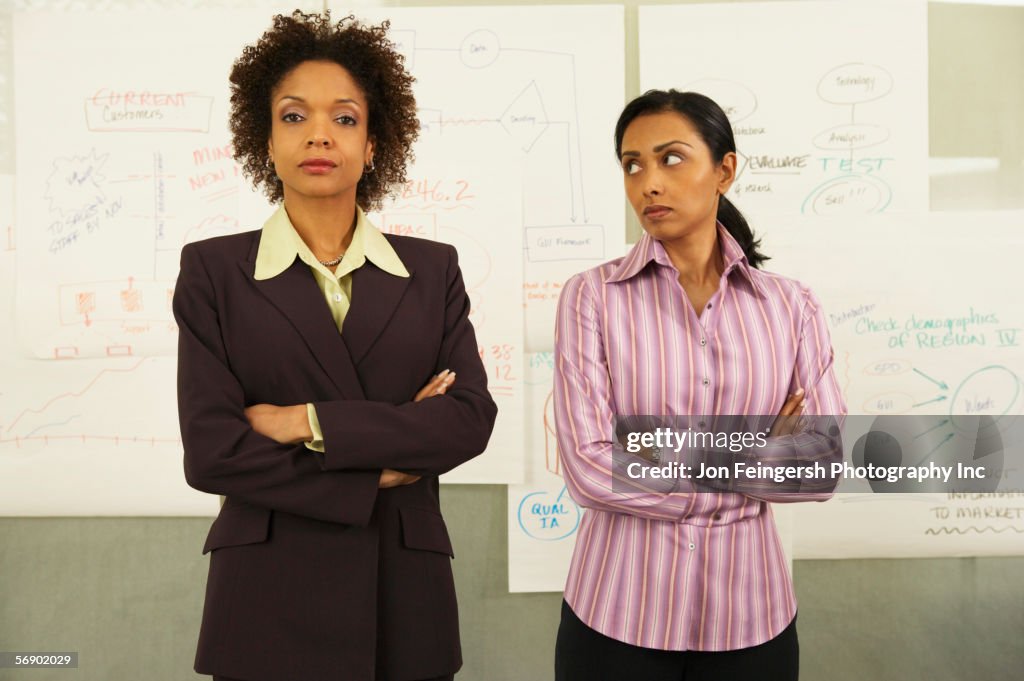 Two businesswomen standing together