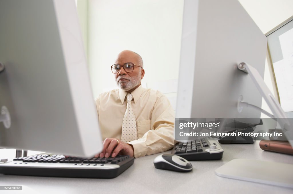 Businessman using computers