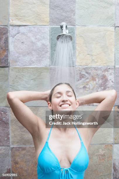 woman taking a shower - women in skimpy bathing suits stock pictures, royalty-free photos & images