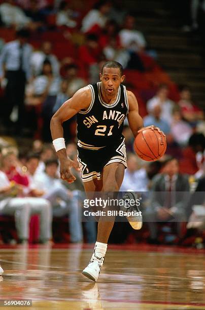 Alvin Robertson of the San Antonio Spurs dribbles upcourt against the Houston Rockets during an NBA game at the Summit circa 1988 in Houston, Texas....