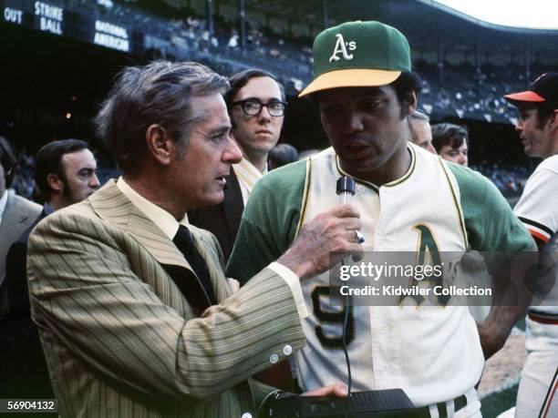 Announcer Curt Gowdy interviews outfielder Reggie Jackson of the Oakland A's prior to the start of the MLB All-Star Game on July 13, 1971 at Tiger...