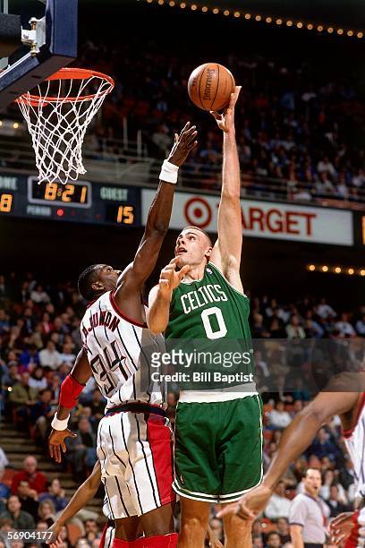 Eric Montross of the Boston Celtics shoots a baby hook shot against the Houston Rockets during an NBA game at the Summit circa 1996 in Houston,...