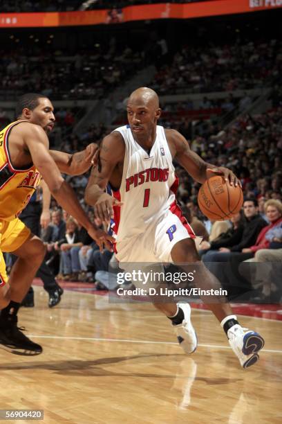 Chauncey Billups of the Detroit Pistons dribbles by Salim Stoudamire of the Atlanta Hawks in a game on February 21, 2006 at the Palace of Auburn...