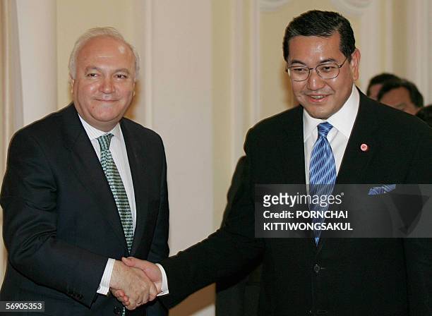 Thai deputy Prime Minister, Surakiart Sathirathai shakes hands with Spanish Foreign Minister Miguel Angel Moratinos at the Government House in...