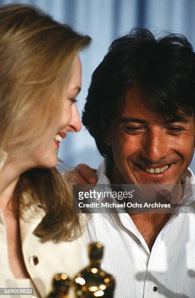 Actor Dustin Hoffman poses backstage with Meryl Streep after winning "Best Actor" and "Best Supporting Actress" for "Kramer vs. Kramer" during the...