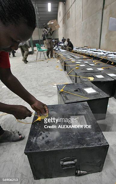 Ugandan Electoral Commission workers prepare ballot boxes in Kampala 22 Febuaray 2006 for the 23 February 2006 presidential election, the first...